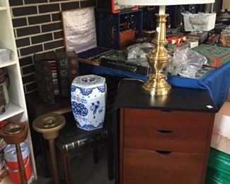 Assortment of nexting tables, porcelain seat, lamps, drop leaf file cabinet, tall pedestal vintage ashtrays and much more!