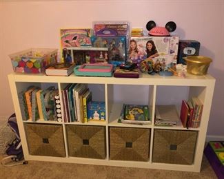 Storage cabinet with bins and toys