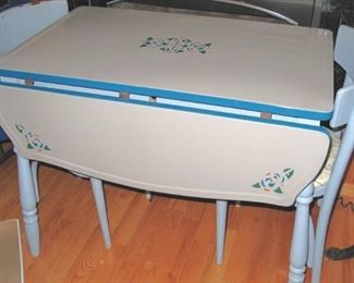 Super enamel dropleaf deco era table with two chairs.