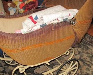 Near mint condition antique wicker baby buggy.
