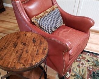 Leather Club Chair. Rustic Side Table. Large Wool Designer Carpet