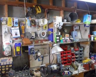 bench grinder, vise, nuts, bolts, screws bins, misc hardware, several lights