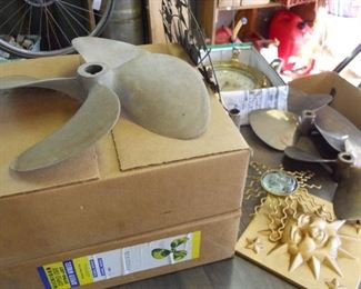 brass vintage propellors 2 18" 3 smaller,, pothole clock, sun moon and stars decor, inexpensive table w/ two leafs, gas cans