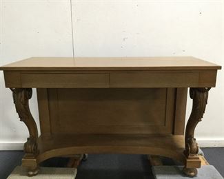 A RENAISSANCE STYLE CARVED WALNUT CONSOLE. Maker Stamp on inside of drawer is from Toby Handmade Furniture, Established 1856, Chicago.  Fitted with two drawers; the cabriole legs boldly carved with acanthus and volutes.  Condition: Refinished .        **In Suite with Dining Table, Set of Chairs  and Buffet