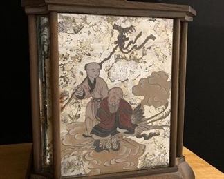 AN UNUSUAL PAIR OF CHINESE VERRE EGLOMISE TABLE LAMPS, 19TH Century, The 6 panels reverse painted with bearded sages and coursans; the 2 back panels have replaced mirrors; the lamp mountings of appreciably later date- with Shades