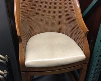 A PAIR OF EDWARDIAN STYLE SWIVEL-MOUNTED
AND CANED FRUITWOOD BAR CHAIRS
Upholstered in a vellum leather; the tapered legs joined by
full stretchers.
Condition: Very good."