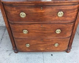 "AN UNUSUAL AMERICAN HEPPLEWHITE STYLE
MAHOGANY BOW-FRONT CHEST OF DRAWERS
Circa 1810
Fitted with three full-width nicely shaped drawers and raised
on short baluster feet; mounted with the original brass bull’seye
plates and pulls.
Condition: The top with some discolorations; however, the
piece showing an especially attractive overall patina."