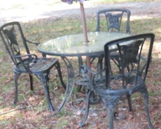 HEAVY METAL BASE OUTDOOR TABLE AND CHAIRS.