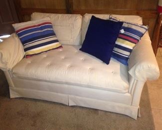 The other white loveseat