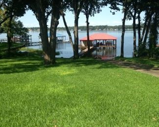 The beautiful lawn leads to the boathouse and lake.