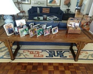 Asian style mahogany sofa table atop a custom made Lacey Champion Carpets wool rug, with dragon motif.