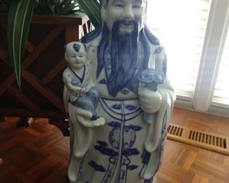 Vintage blue/white Asian porcelain figure, proud Dad with son, who should be crying with that weird haircut! 