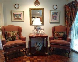 Pair of freshly upholstered Ralph Lauren-ish wingback chairs, with stretchers and English tapestry pillows, Egyptian Revival entry table, Herend-ish porcelain table lamp and large Asian porcelain urn.