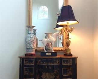 Vintage Asian linen press, with Tang Horse (AD 618 - 907) graduated pair of Rose medallion vases, gilt bronze, French wired table lamp and FABBY 18th century silvered mirror in gilt wood frame.