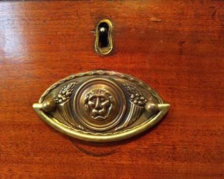 Detail of the cool brass drawer pulls on this antique English chest.