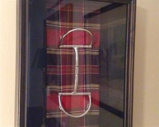 One of a pair of vintage, shadow boxed English tack, with plaid ribbon.