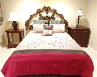 Elaborately carved wooden headboard queen size bed, with all linens, mahogany/beveled glass curio cabinet and 4-drawer 1940's mahogany bachelor chest.
