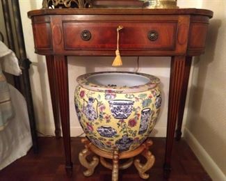 1940's mahogany end table, with single drawer, vintage Asian yellow porcelain fishbowl on wooden stand. 