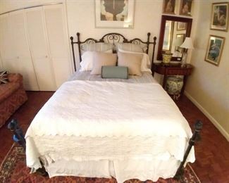 Vintage queen size metal bed with all Yves Delorme linens.