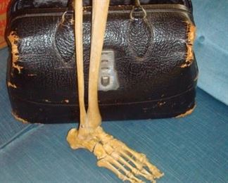 One's of two doctor's bags and human foot & leg bones. 
