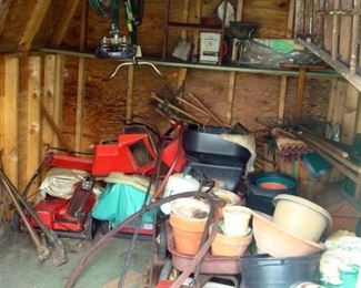 Shed, containing a lady's bike, chipper, lawn mower , planters and etc.