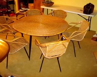Mid century rattan patio table and six chairs.