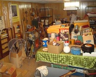 One view of basement. There's a pool table under all those items!!