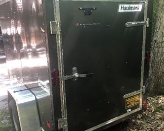 Practically New! 5 by 8 ft Haulmark Covered Enclosed Cargo Trailer 