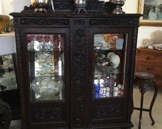 outstanding Brazilian carved hacienda style lighted china/curio cabinet– beautiful Brazilian exotic walnut– $395