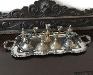 Sterling silver candlesticks waited $20 per pair, sterling silver salt and pepper shakers Hollow ware $30 per pair, sterling silver triple candelabra $30, larger silver plate candlesticks on the outside $14 and silver plate serving tray $40