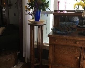 plant stand and floral arrangement