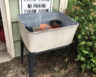 Galvenized tub with stand, signs