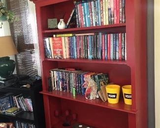 Red bookcase and books 