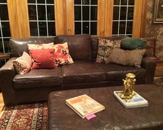 Restoration Hardware deep leather sofa with matching leather ottoman 