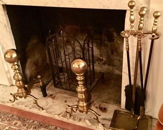 Large brass andirons and fireplace tools