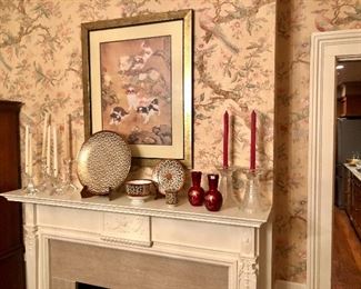 Mantel decorated with various Asian (oriental) themed items including the art with dogs on silk