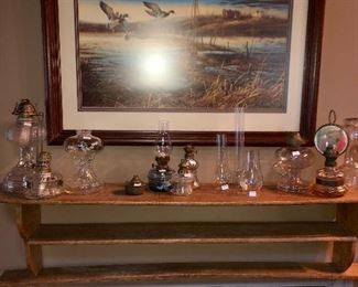 Ducks unlimited print signed, collection of antique oil lamps in various sizes and styles.