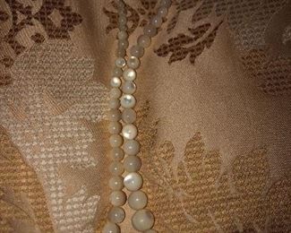 Uncertain what theses beads are with a bone clasp.  