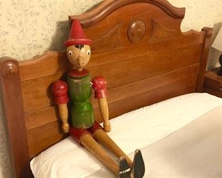 Antique full size bed, antique wooden pinnochio doll