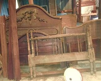Several antique wooden beds