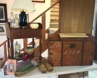 Antique table w/ drawer, porcelain collectibles, wooden clogs, primitive trunk, etc.