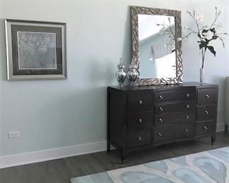 Dresser, mirror, area rugs.