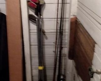 Assorted sporting goods, including golf clubs and fishing poles!