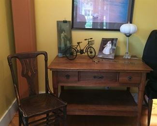 Oak Entry Table Desk with Unique Drawer in Center; oak side chair; great wall art; WWI Over There Print; Decorative Table Top Bike art; and Vintage Lamp