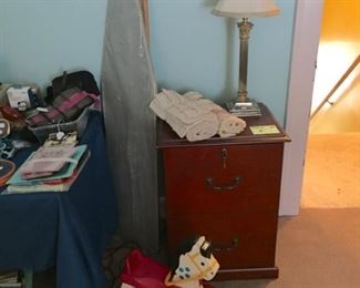Cherry Two Drawer File Cabinet; lamp; Fisher Price Riding Horse; and Ironing Board
