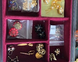 A full table of costume jewelry - no gold or sterling all costume jewelry .