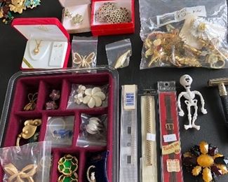 A full table of costume jewelry - no gold or sterling all costume jewelry .