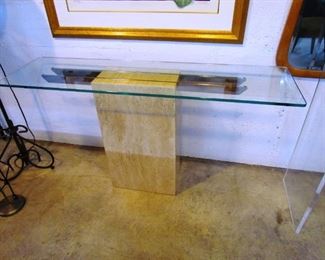 Very minimalist console table.  Heavy glass top on marble base.  