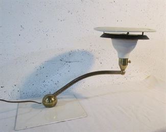 Unusual modernist lamp on heavy metal base with metal shade.
