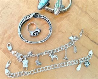 Silver charm bracelets and rings